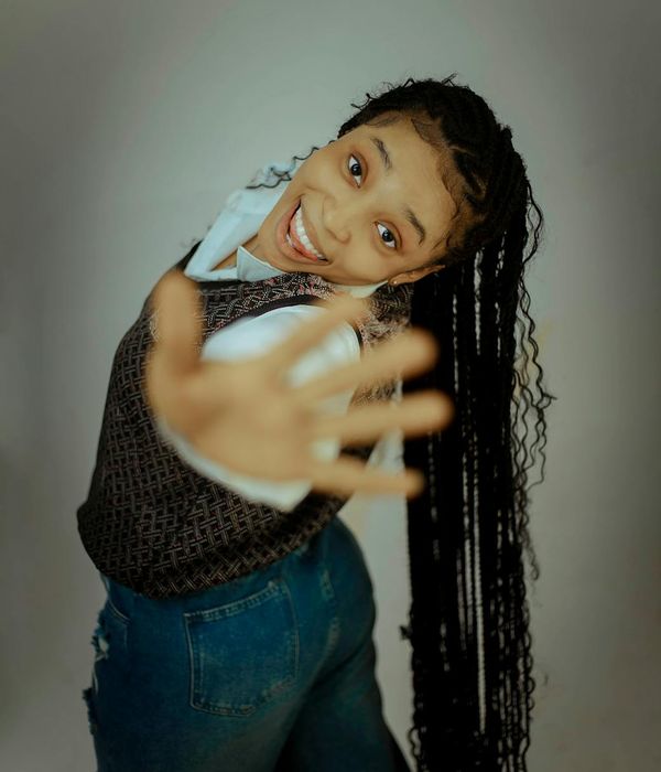 Woman in a dynamic cardio pose, feeling energetic and full of life.